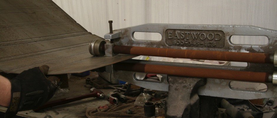 The jaws on the roller are 18” deep, just barely enough for this floor job. If the panel had been wider, we would have had to make two panels. We started in the middle of the panel, because the metal curves during the process.