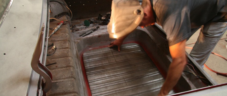 The panel was placed into the trunk and positioned. Toby had made some alignment marks so that everything would match up after the original floor was removed.