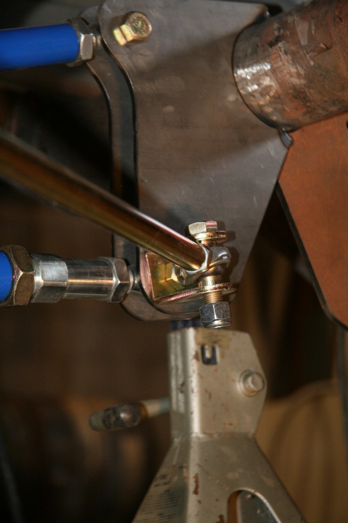 The last step is mounting the track locator bar. This bar centers the rear housing under the car. This can be done with a panhard bar, track locator or Watt’s Link. The track locator bolts to opposing sides (one front and one rear) for the ladder bar mounting bolts with rod ends. Turning the rod moves the rear left or right depending on your needs.