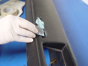 18. A little body filler is mixed up and spread into the cavity. Enough filler was put in for some excess to squeeze out, which is what we want.