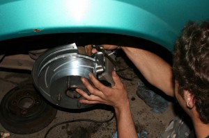20.The rotors were slid over the lugs and the calipers were placed over them. Each rotor is left-hand, right-hand specific. The slots should roll forward, like the picture here: