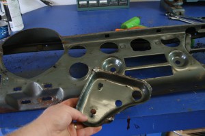 7.The switches and knobs to the right of the gauge cluster used a metal box behind the dash as a mount. This piece was spot welded in place. This had to be removed to fit the new gauges in the dash.