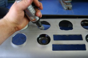 9.The wire mesh had to be trimmed out as well. Here we used a die-grinder and a metal stone to open it up to the same size as the dash.