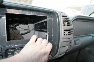 14.Next, the bezel was installed in the truck along with the slider clips in the original positions for the dash kit. The locations of the sliders were marked on the bezel. This gives us the position we needed to make the mount for the deck.