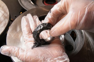 09.We packed the bearings by hand with some moly grease. You can use a bearing packer too. We then installed the inside bearings and seal to the rotor.
