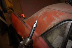 05.There are quite a few spot welds in the door jamb, wheel well and tail panel on the original quarter panel which have to be cut. To make it easy, we used this spot-weld cutter from Eastwood. The spring-loaded pilot bit makes this much easier than any other spot-weld cutter.
