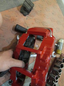 All four calipers come unassembled. We installed the lugs for the brake pad pucks and then loaded the pucks into the calipers. The lugs keep the puck’s movement square to the rotor, reducing noise and chatter.