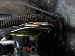 The trick to soldering a second wire into the middle of another is to split the continuous wire and slide the new wire between.