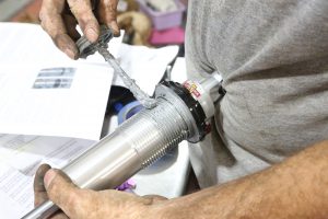 34. We coated the threads on the shocks with anti-seize. This keeps the ring collars from galling up on the aluminum shock body. Leave it off and you may very well ruin the shock.