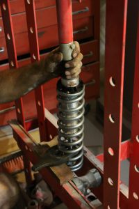 35. The springs for our car were quite stiff, so much so we had to use a press to get the upper spring keeper in place.